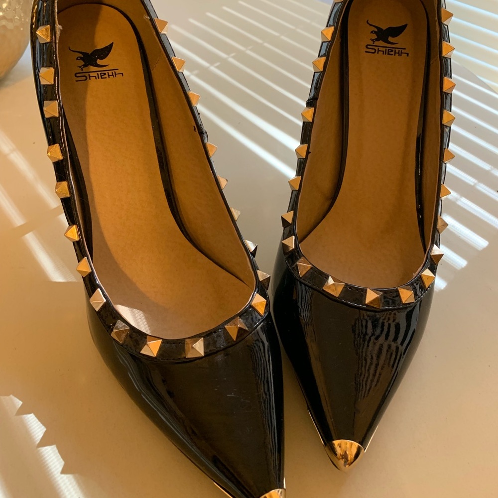 Stunning black with gold-studded pumps
